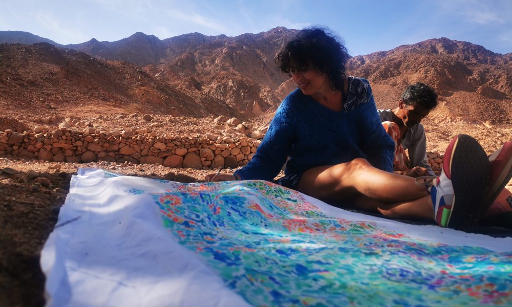 Isabelle Arvers Painting in Al Okda, a wadi (valley) that has one of the oldest well in Sinai