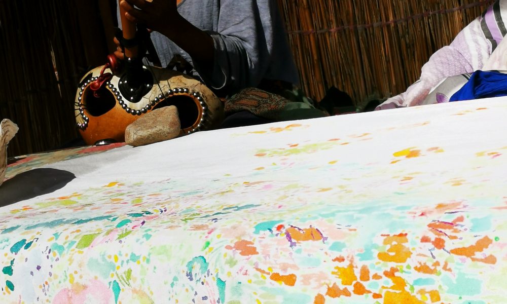 Painting with Saki Wakita playing ngoni