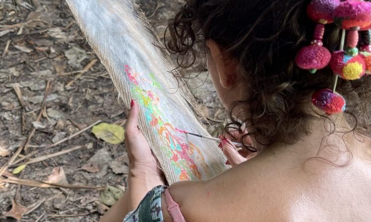 Isabelle arvers paints on coco trees at the slave steps in petit canal Guadeloupe