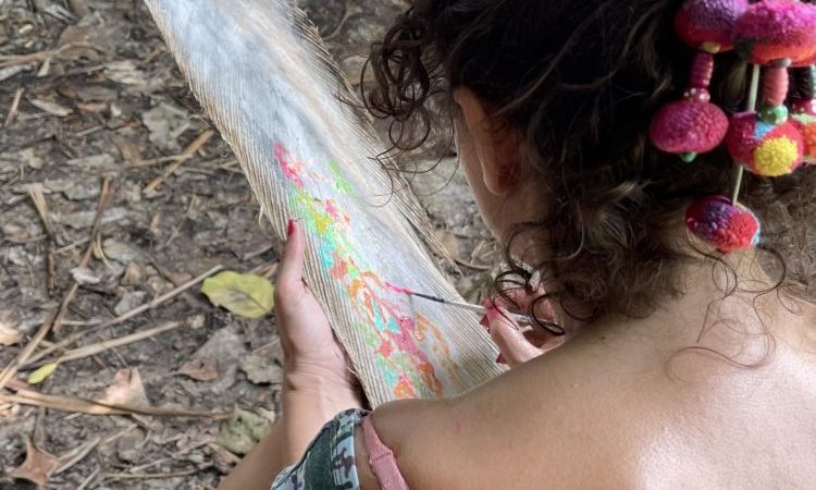 Isabelle arvers paints on coco trees at the slave steps in petit canal Guadeloupe