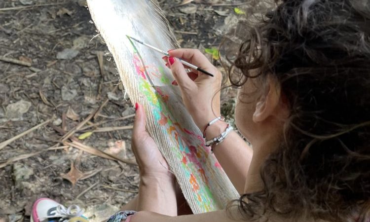 Isabelle arvers paints on coco trees at the slave steps in petit canal Guadeloupe