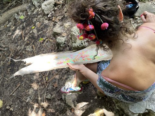 Isabelle arvers paints on coco trees at the slave steps in petit canal Guadeloupe