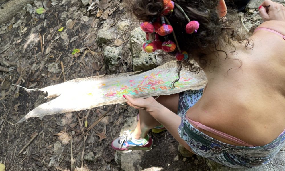 Isabelle arvers paints on coco trees at the slave steps in petit canal Guadeloupe